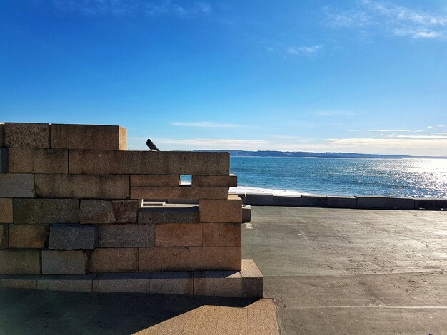 Scenic view of sea against blue sky