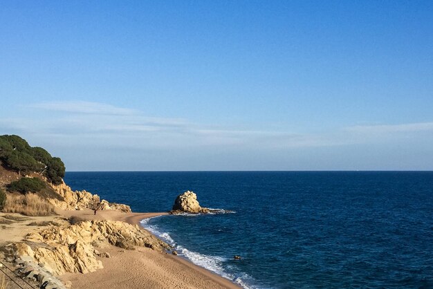 Photo scenic view of sea against blue sky