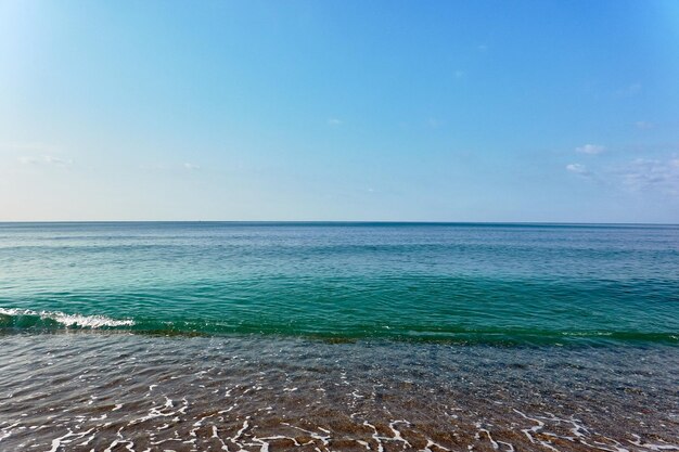 Photo scenic view of sea against blue sky