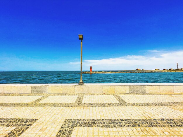 Scenic view of sea against blue sky