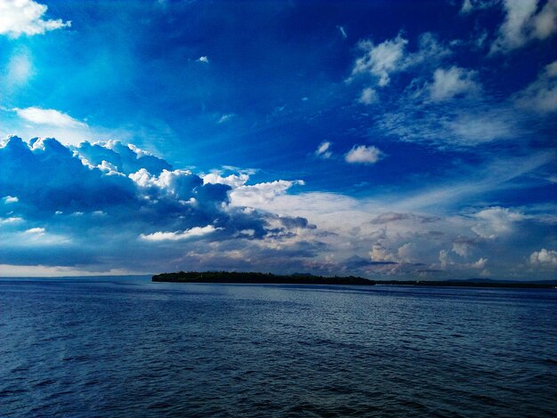 Scenic view of sea against blue sky