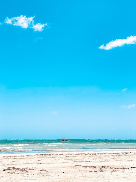 Photo scenic view of sea against blue sky