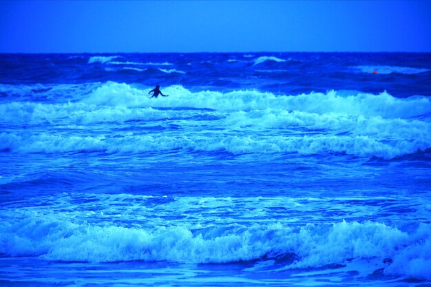 Scenic view of sea against blue sky