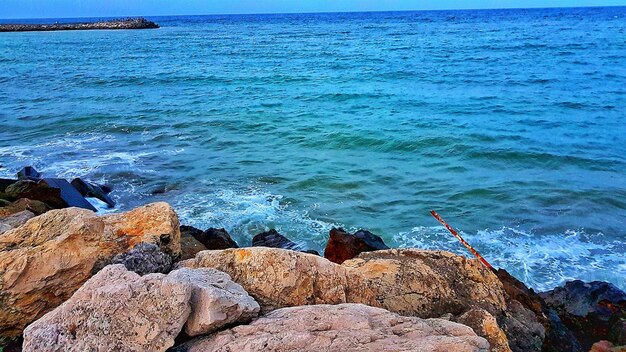 Scenic view of sea against blue sky