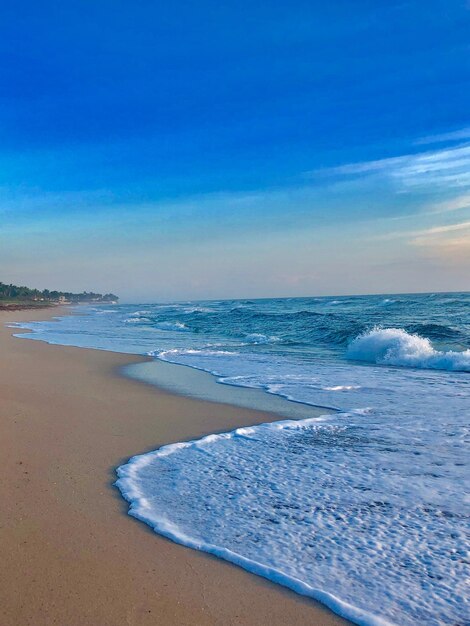 Scenic view of sea against blue sky