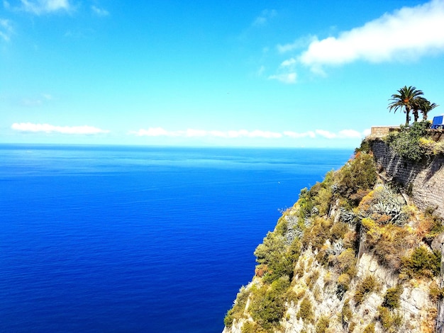 Scenic view of sea against blue sky