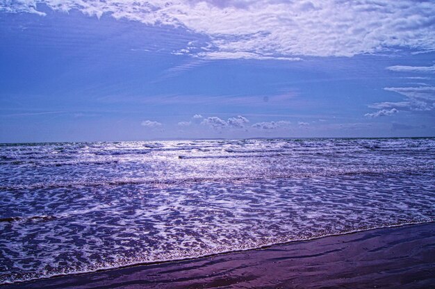 Scenic view of sea against blue sky