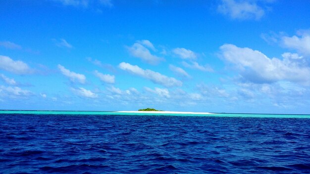 Scenic view of sea against blue sky