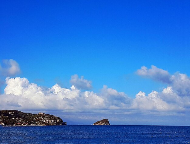 Scenic view of sea against blue sky