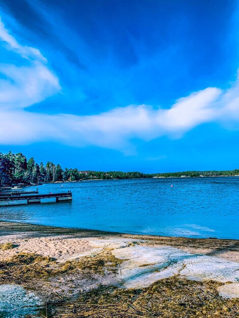 Scenic view of sea against blue sky