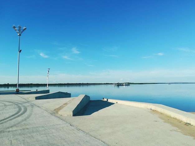 Scenic view of sea against blue sky