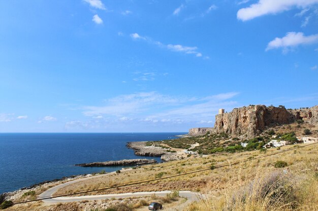 Scenic view of sea against blue sky