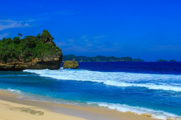 Scenic view of sea against blue sky