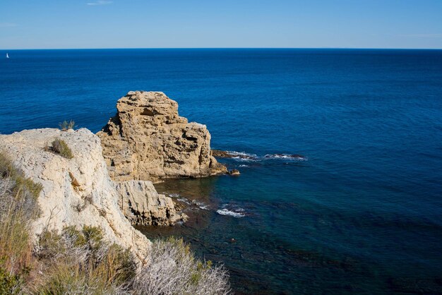 Scenic view of sea against blue sky