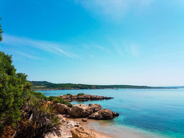 Scenic view of sea against blue sky