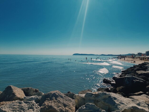 Scenic view of sea against blue sky