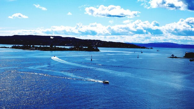 Scenic view of sea against blue sky