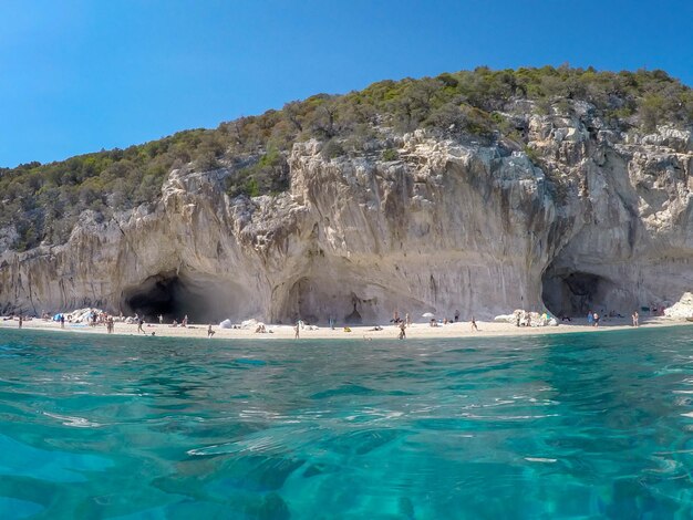 Scenic view of sea against clear blue sky at cala luna beach sardinia italy