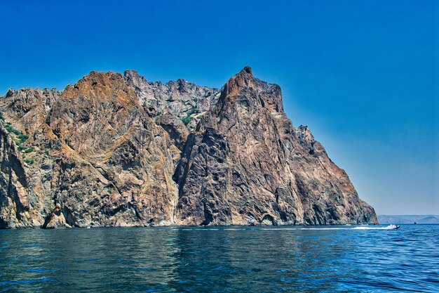 Scenic view of sea against clear blue sky