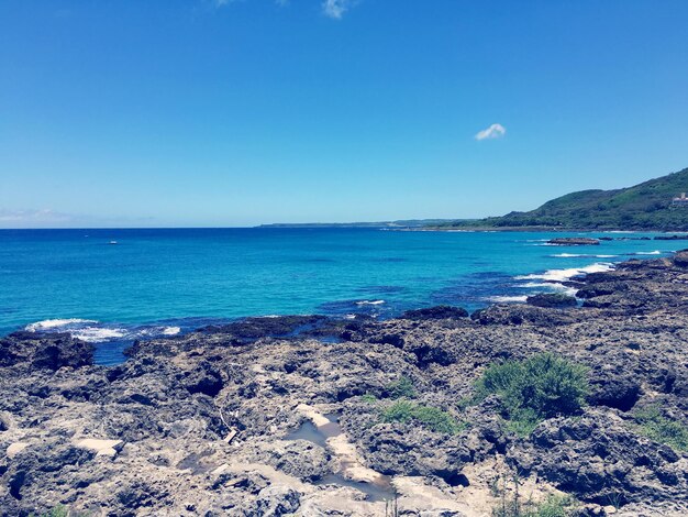 Scenic view of sea against clear blue sky