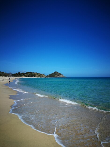 Scenic view of sea against clear blue sky