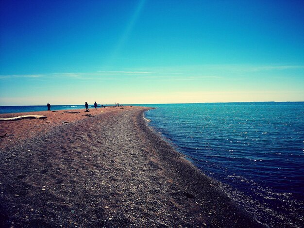 Scenic view of sea against clear blue sky