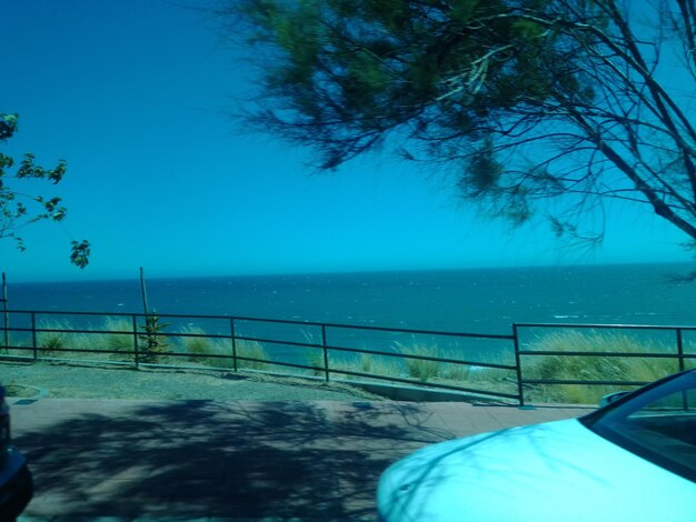 Scenic view of sea against clear blue sky