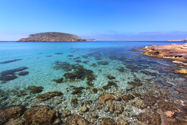 Scenic view of sea against clear blue sky