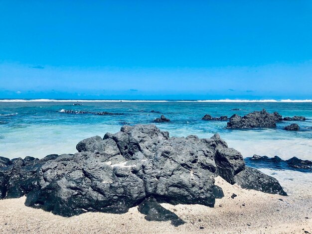 Scenic view of sea against clear blue sky