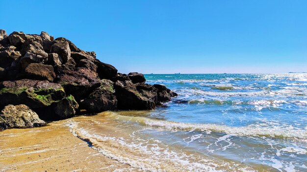 Scenic view of sea against clear blue sky