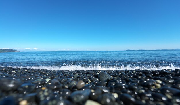 Scenic view of sea against clear blue sky