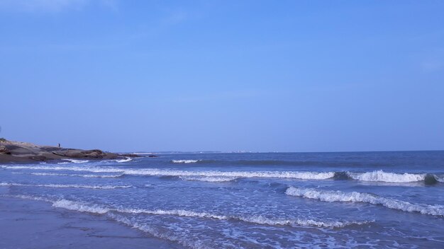 Scenic view of sea against clear blue sky