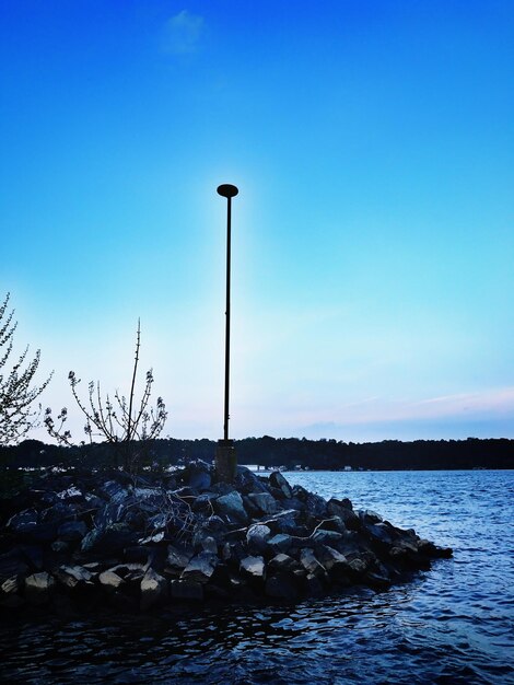 Scenic view of sea against clear blue sky