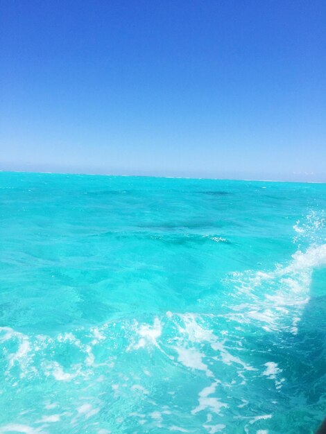 Scenic view of sea against clear blue sky