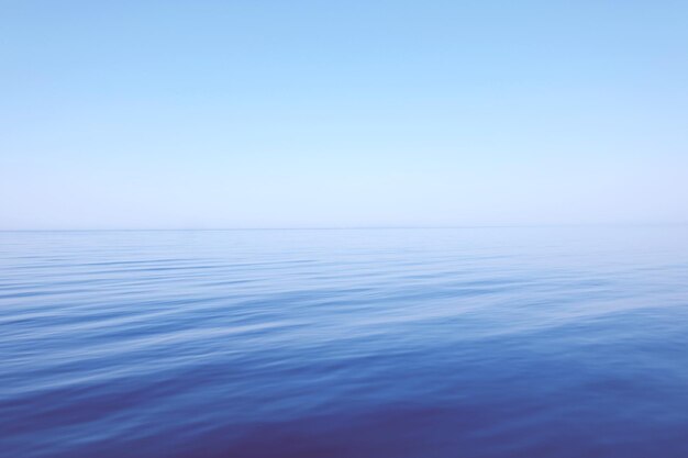 Photo scenic view of sea against clear blue sky