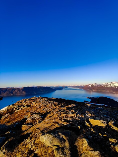 Scenic view of sea against clear blue sky