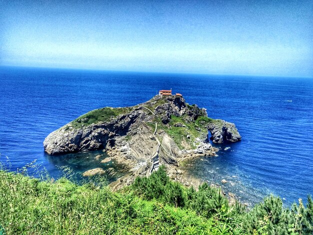 Scenic view of sea against clear blue sky