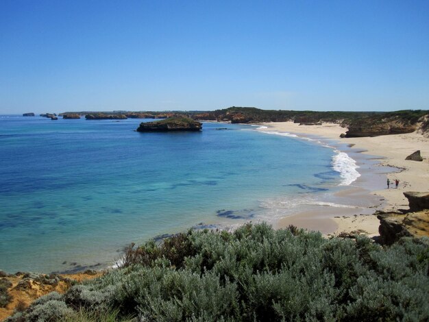 Scenic view of sea against clear blue sky