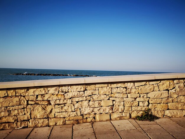 Photo scenic view of sea against clear blue sky