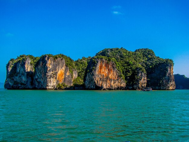 Scenic view of sea against clear blue sky