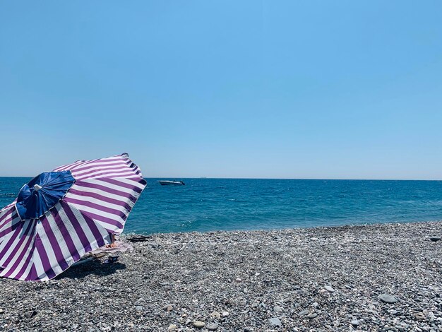 Photo scenic view of sea against clear blue sky