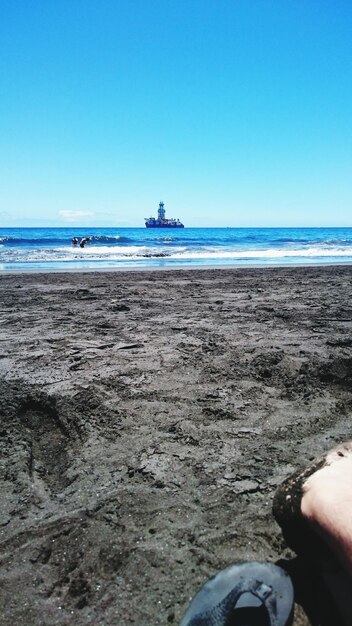 Scenic view of sea against clear blue sky