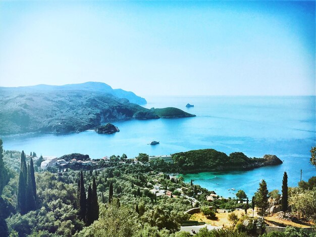 Scenic view of sea against clear blue sky