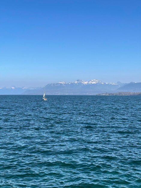 Scenic view of sea against clear blue sky