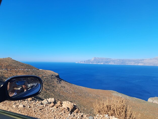 Scenic view of sea against clear blue sky