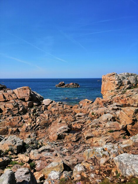 Scenic view of sea against clear blue sky