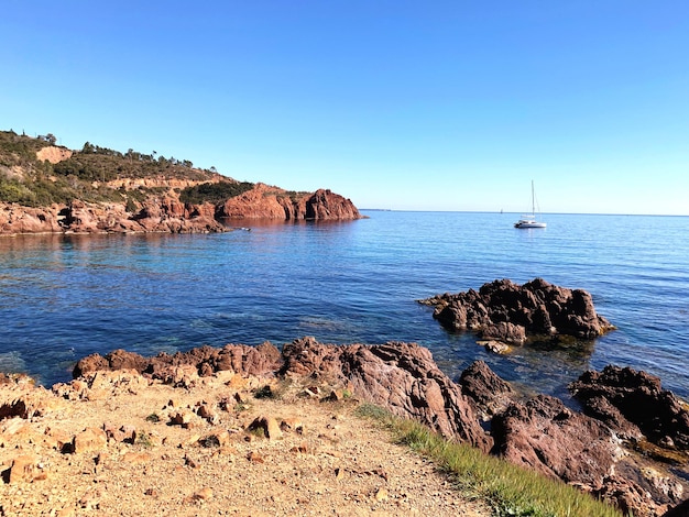 Scenic view of sea against clear blue sky