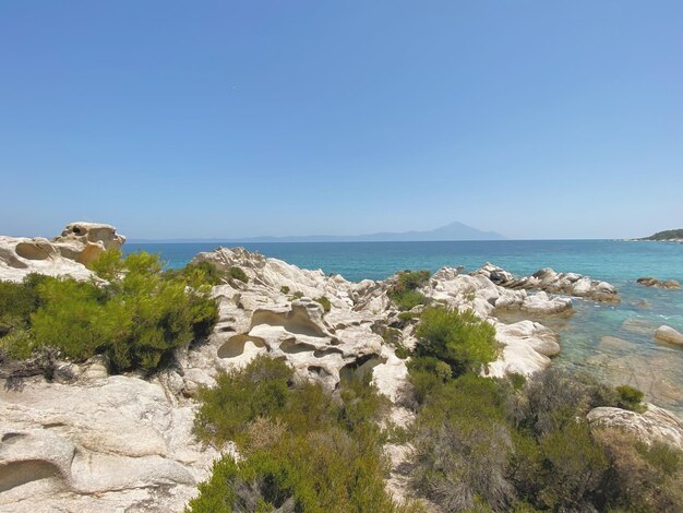 Scenic view of sea against clear blue sky