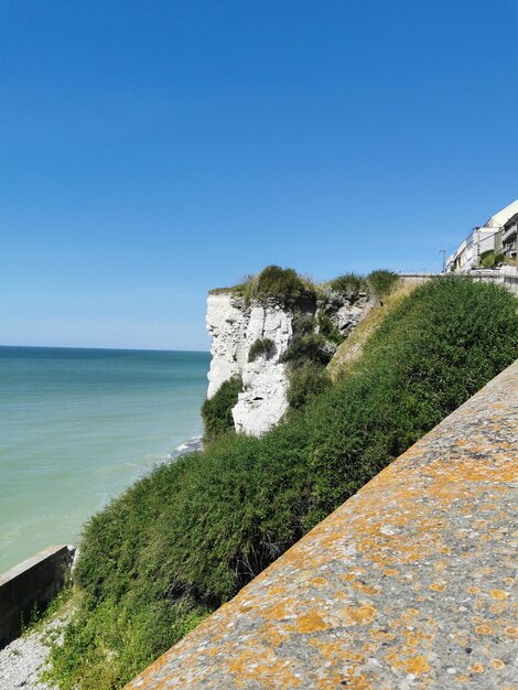 Scenic view of sea against clear blue sky