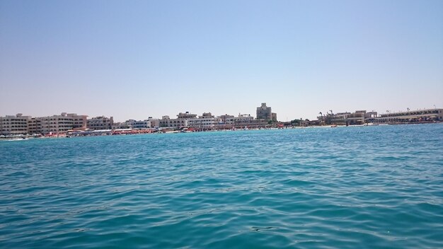 Scenic view of sea against clear blue sky